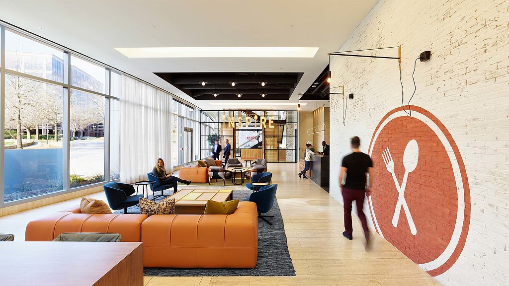 A room with a large glass wall and a large red heart painted on the wall.
